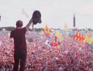 Ed Sheeran performing to a massive crowd. Captured from the "Photograph" music video